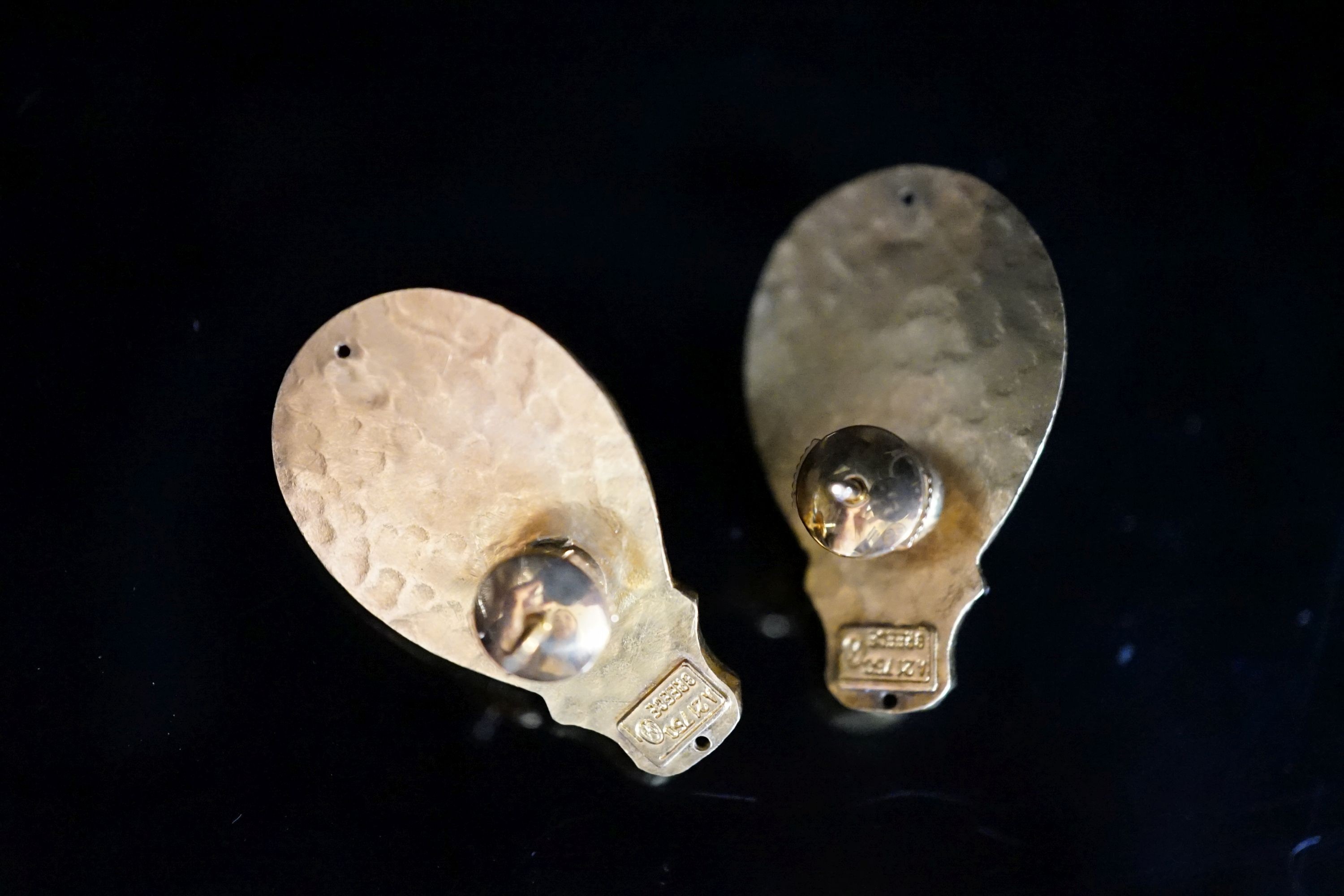 Attributed to Ilias Lalaounis, a pair of planished 750 yellow metal and cabochon amethyst set earrings, 30mm, 15.1 grams gross.